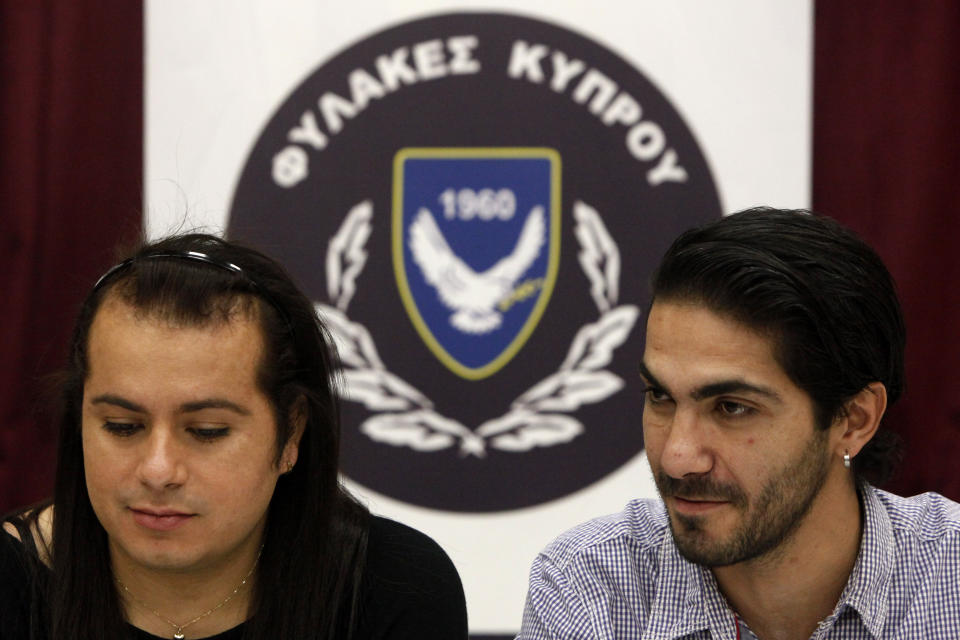 Cypriot Kevork Tontian, right, and Brazilian Wemson Gabral da Costa talk during an interview inside Cyprus' prison complex in capital Nicosia, Cyprus, Thursday, Jan. 16, 2020. Former heroin addict Kevork Tontian says he met the man he wanted to spend the rest of his life with behind bars, and not even his freedom was enough to keep him away from Wemson Gabral da Costa. (AP Photo/Petros Karadjias)