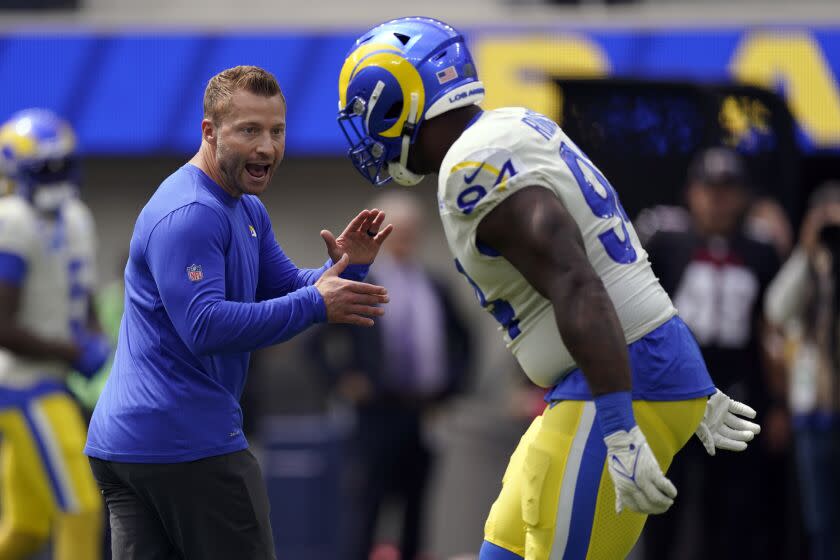 Los Angeles Rams head coach Sean McVay, left, talks with defensive tackle A'Shawn Robinson.