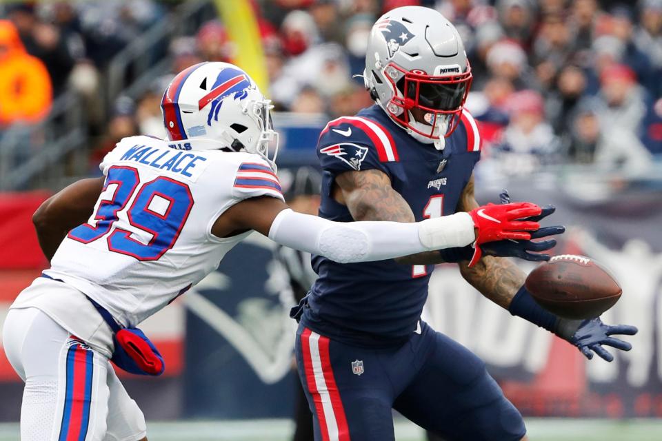 Buffalo Bills cornerback Levi Wallace (39) breaks up a pass to New England Patriots wide receiver N'Keal Harry (1) during the first half of an NFL football game, Sunday, Dec. 26, 2021, in Foxborough, Mass.