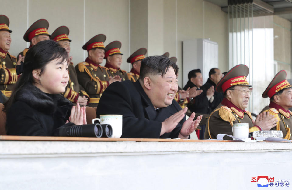 This photo provided by the North Korean government shows North Korean leader Kim Jong Un, center, and his daughter, left, watch the sports games by the staff of the cabinet and the Ministry of National Defence at an undisclosed location in North Korea, on Feb. 17, 2023. Independent journalists were not given access to cover the event depicted in this image distributed by the North Korean government. The content of this image is as provided and cannot be independently verified. Korean language watermark on image as provided by source reads: "KCNA" which is the abbreviation for Korean Central News Agency. (Korean Central News Agency/Korea News Service via AP)