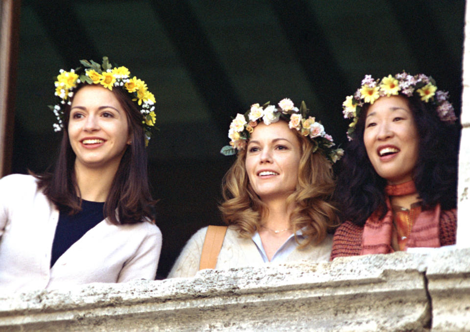 Giulia Steigerwalt, Diane Lane, and Sandra Oh look over a window