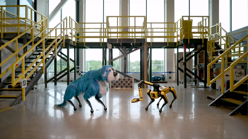  A screenshot form a YouTUbe video showing Boston Dynamics' Sparkles, essentially a Boston Dynamics' Spot dressed up in a silly blue dog costume. 