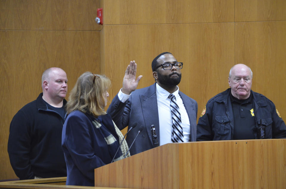 Defendant Willie Cory Godbolt is sworn in before telling the court he did not want to testify on his own behalf in his capital murder trial Monday, Feb. 24, 2020 during Day 9 of testimony at the Pike County Courthouse, in Magnolia, Miss. Pictured are, from left: Master Sgt. Keith Dickerson with the Lincoln County Sheriff's Office, defense attorney Alison Steiner, Godbolt and Lincoln County Jail Warden Randy Pickett. Godbolt, 37, is on trial, for the May 2017 shooting deaths of eight people in Brookhaven. (Donna Campbell/The Daily Leader via AP, Pool)