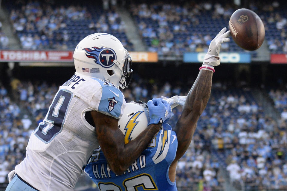 <p>Tennessee Titans wide receiver Tajae Sharpe, left, grabs the helmet of San Diego Chargers cornerback Casey Hayward, right, during the second half of an NFL football game Sunday, Nov. 6, 2016, in San Diego. Sharpe was called for interference on the play. (AP Photo/Denis Poroy) </p>