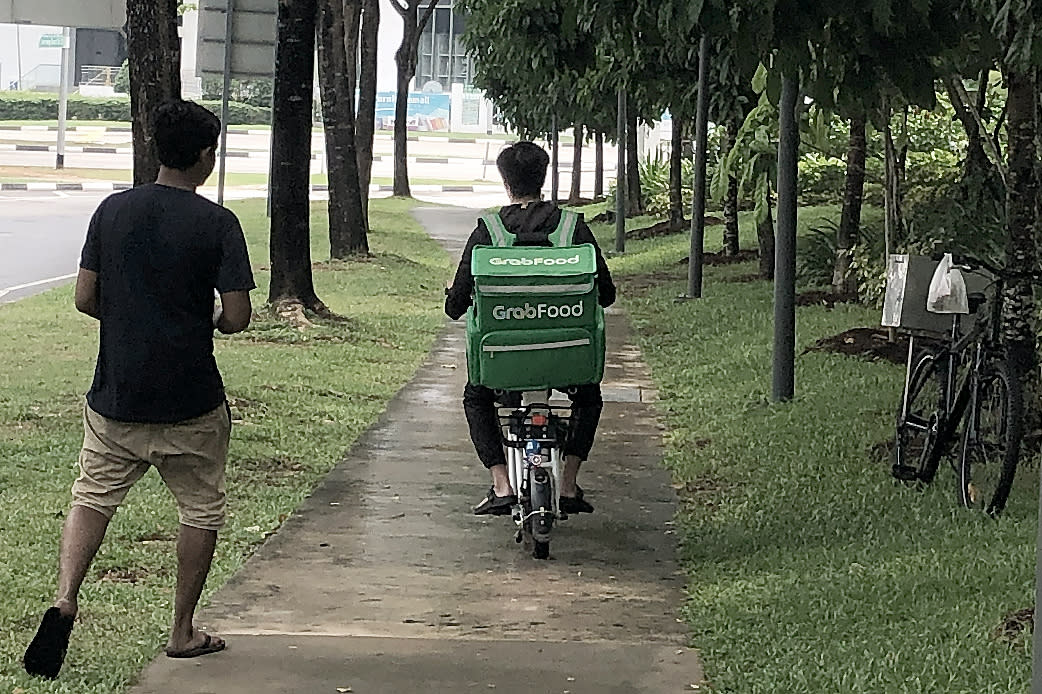 A GrabFood delivery rider on an e-scooter seen along Jurong East Street 21 on 5 November 2019. (PHOTO: Dhany Osman / Yahoo News Singapore)