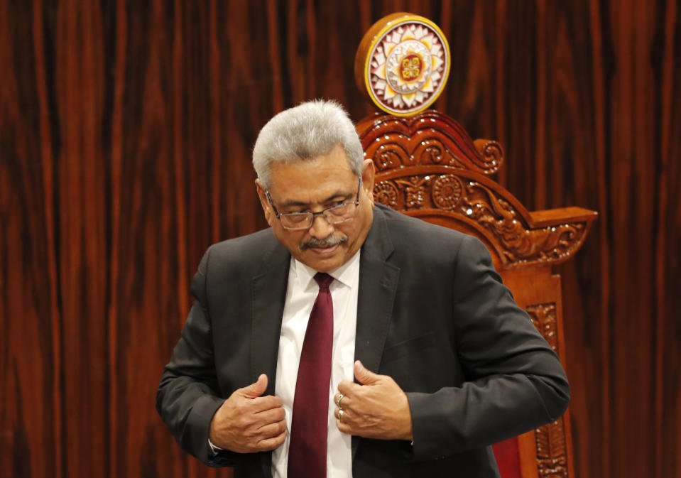 FILE - In this Jan. 3, 2020, file photo, Sri Lankan President Gotabaya Rajapaksa leaves after addressing parliament during the ceremonial inauguration of the session, in Colombo, Sri Lanka. A proposed amendment to Sri Lanka’s constitution that will consolidate powers in the President’s hands has raised concerns about the independence of the country’s institutions and the impact on its ethnic minorities who fear their rights could be undermined by the majoritarian will.(AP Photo/Eranga Jayawardena, File)