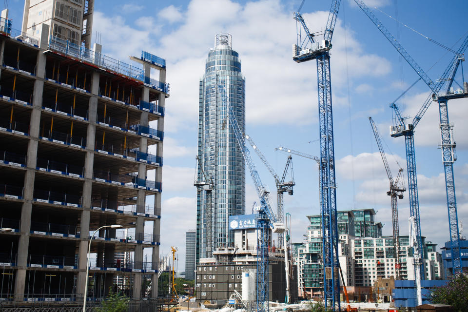 Cranes work on a construction site near to the 50-storey St George Wharf Tower in the Vauxhall area of London, England, on July 15, 2019. Research by the New London Architecture forum released earlier this year revealed that 76 tall buildings (defined as those over 20 storeys high) are projected to be completed in the capital over the course of 2019, just two years on from the devastating fire at residential high-rise Grenfell Tower in North Kensington. The figure represents a three-fold increase over the number of completions in 2018, with the NLA's 2019 'London Tall Buildings Survey' estimating that those towers under construction may altogether provide more than 110,000 new homes across the city.  (Photo by David Cliff/NurPhoto via Getty Images)