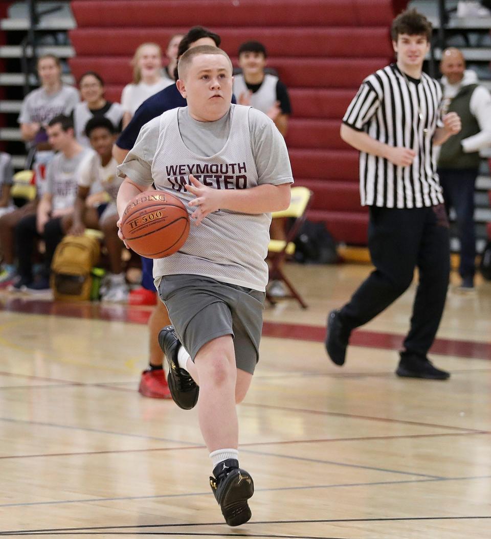 Weymouth High player Kenny Pratt drives to the basket for a layup. The Weymouth High Unified Basketball team hosted Walpole on Monday, Oct. 3, 2022.