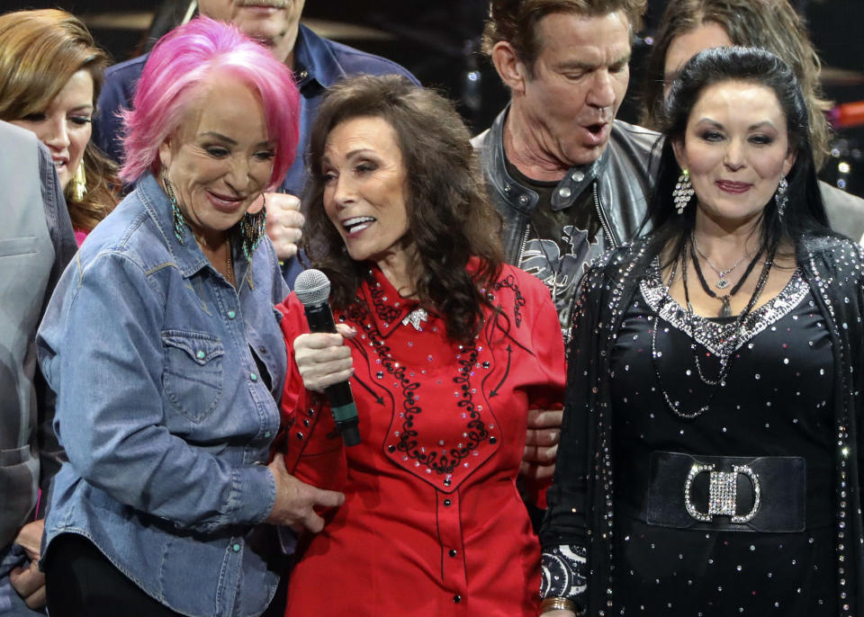 Loretta Lynn, center, Tanya Tucker, left, and Crystal Gayle perform at Loretta Lynn's 87th Birthday Tribute at Bridgestone Arena on Monday, April 1, 2019, in Nashville, Tenn. (Photo by Al Wagner/Invision/AP)