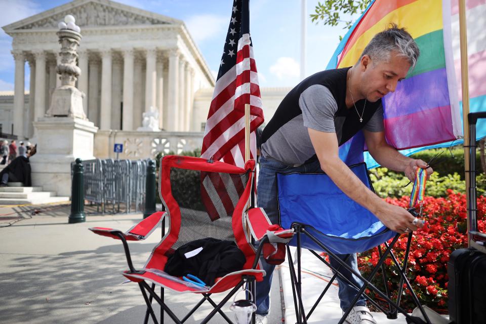 Eddie Reynoso waits in line outside the U.S. Supreme Court building in October 2019 for the chance to attend arguments during which the justices will consider whether employers may fire employees for being gay or transgender.