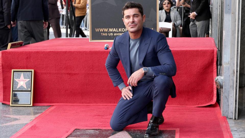 PHOTO: Zac Efron poses with his star during his Hollywood Walk of Fame Star Ceremony on December 11, 2023 in Hollywood, Calif. (Leon Bennett/Getty Images)