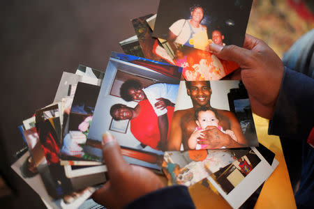 Quinta Sanders shows photos she saved of her son, Tory Sanders, at her home in Nashville, Tennessee, U.S. October 10, 2017. Picture taken October 10, 2017. REUTERS/Harrison McClary