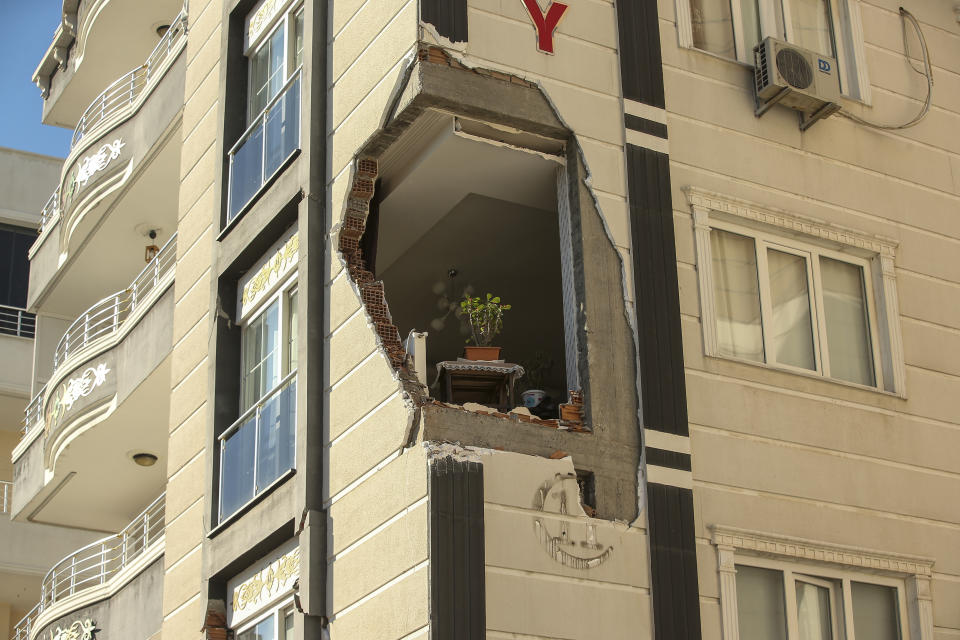 A damaged building in Adiyaman, southern Turkey, Thursday, Feb. 9, 2023. Thousands who lost their homes in a catastrophic earthquake huddled around campfires and clamored for food and water in the bitter cold, three days after the temblor and series of aftershocks hit Turkey and Syria. ( AP Photo/Emrah Gurel)