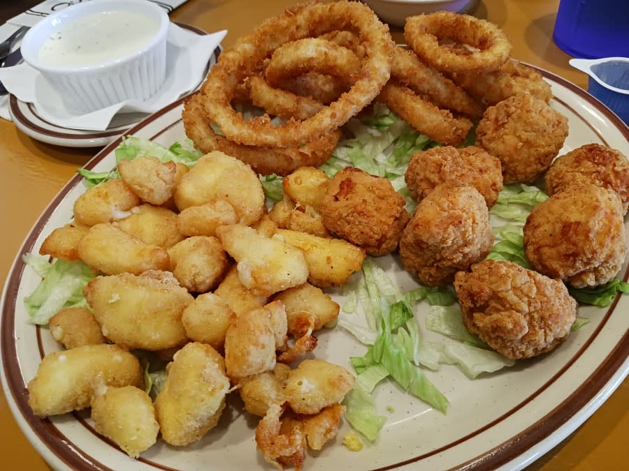 The Stack’s sampler features fried cheese curds, onion rings and popcorn chicken.