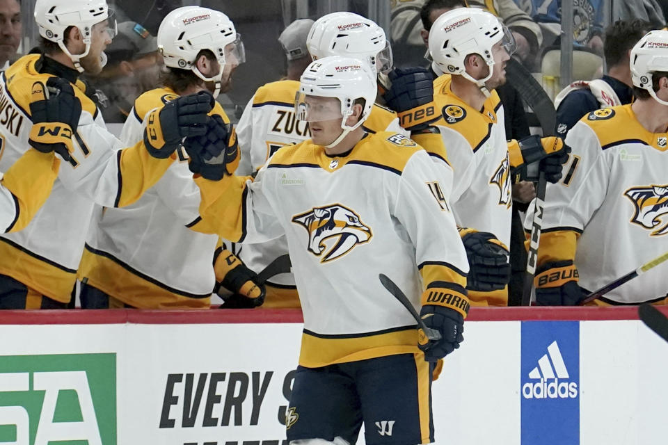 Nashville Predators' Gustav Nyquist (14) returns to the bench after scoring against the Pittsburgh Penguins during the second period of an NHL hockey game, Monday, April 15, 2024, in Pittsburgh. (AP Photo/Matt Freed)