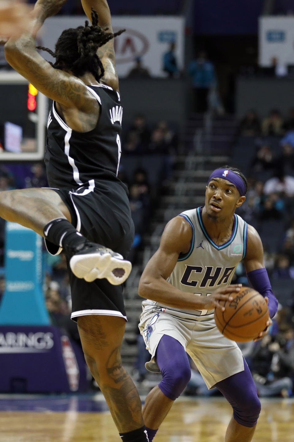 Charlotte Hornets' Devonte' Graham (4) draws a shooting foul on Brooklyn Nets' DeAndre Jordan during the second half of an NBA basketball game in Charlotte, N.C., Friday, Dec. 6, 2019. The Nets won 111-104. (AP Photo/Bob Leverone)