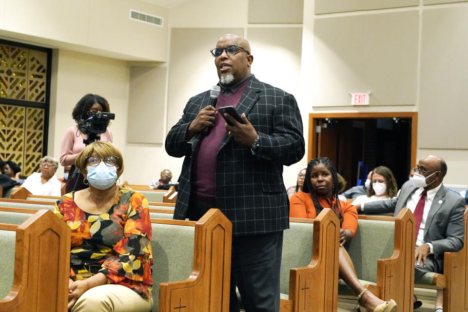 Pastor Dwayne Pickett, of New Jerusalem Church in Jackson, questions Mayor Chokwe Antar Lumumba during a community meeting at College Hill Missionary Baptist Church regarding a number of issues brought before the city's residents, including the water treatment plant, during a community meeting held at College Hill Missionary Baptist Church, on Tuesday, Sept. 13, 2022, in Jackson, Miss. The meeting was held to update the public on the current water system situation. (AP Photo/Rogelio V. Solis)