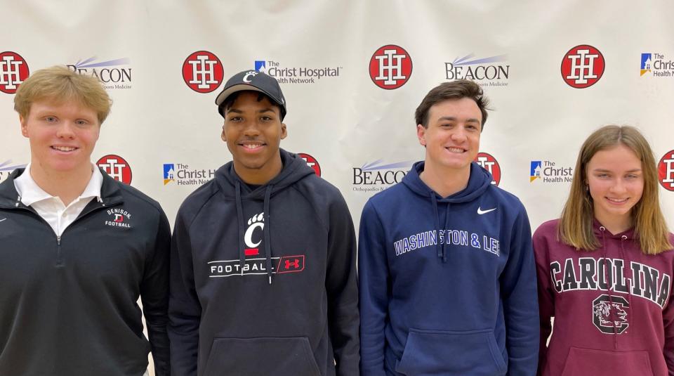 Indian Hill High School seniors Garrett McClung (Denison football), Antwan Peek (University of Cincinnati football), Peter Sheakley (Washington & Lee golf) and Hayden Withers (University of South Carolina track & field and cross country) participated in an athletic signing ceremony March 24, 2022.