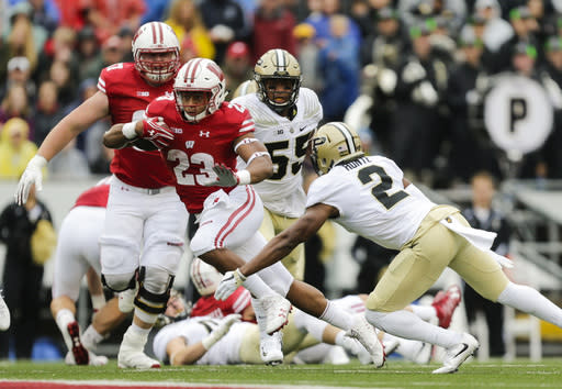 Wisconsin running back Jonathan Taylor gets past Purdue cornerback Da’Wan Hunte (2) on a 67-yard touchdown run during the first half of an NCAA college football game, Saturday, Oct. 14, 2017, in Madison, Wis. (AP Photo/Andy Manis)