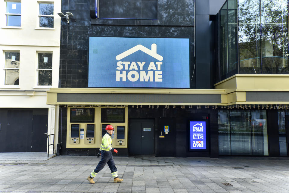  A man walking past the Odeon Luxe in Leicester Square where a digital screen showing a message saying ‘Stay at home. England has entered into the 2nd Lockdown due to the Pandemic. (Photo by Dave Rushen / SOPA Images/Sipa USA) 