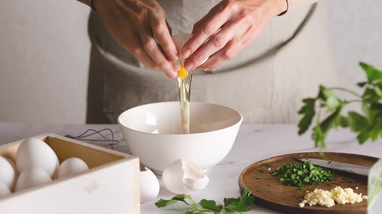 cracking egg into bowl