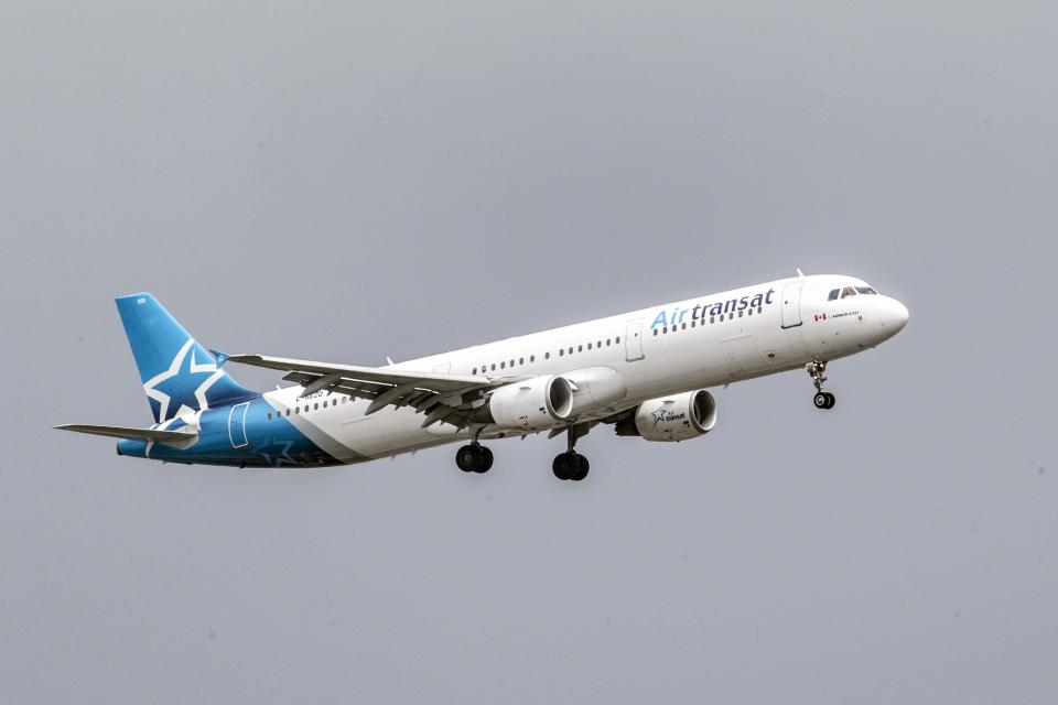 TORONTO, ON: An Air Transat Airline plane lands at Pearson International Airport. (Andrew Francis Wallace/Toronto Star via Getty Images)