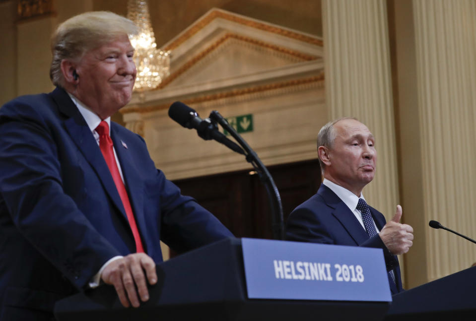 FILE - Russian President Vladimir Putin, right, and U.S. President Donald Trump give a joint news conference at the Presidential Palace in Helsinki, Finland, July 16, 2018. As Trump becomes the first former president to face federal charges that could put him in jail, many Europeans are watching the case closely. But hardly a single world leader has said a word recently about the man leading the race for the Republican party nomination. (AP Photo/Pablo Martinez Monsivais, File)