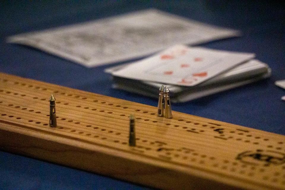 Bill McClain commissioned the tournament cribbage boards from a craftsperson in Bandon. The pegs resemble mini lighthouses.