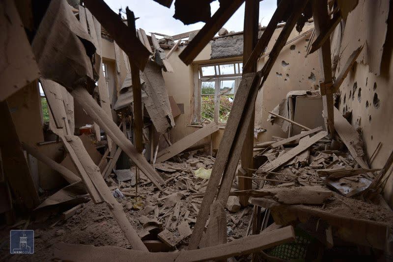 An interior view shows a damaged house in Martuni