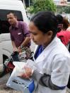 Members of an Indian medical team leave the Mount Elizabeth Hospital in Singapore, on December 27, 2012. An Indian student who was left fighting for her life after being brutally gang raped on a bus in New Delhi arrived in Singapore for further medical treatment