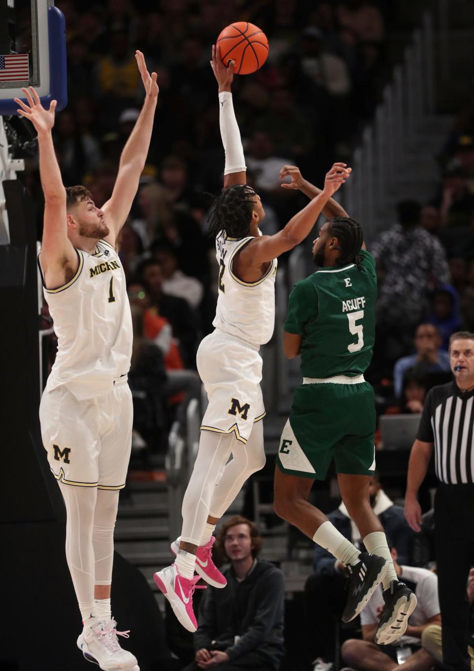 Michigan guard Kobe Bufkin blocks a shot by Eastern Michigan guard Tyson Acuff during the first half of U-M's 88-83 win on Friday, Nov. 9, 2022, at Little Caesars Arena.