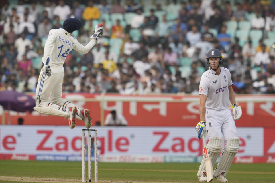 India's wicketkeeper Srikar Bharat collects a throw at the stamps as England's Zak Crawley watches on the third day of the second cricket test match between India and England in Visakhapatnam, India, Sunday, Feb. 4, 2024. (AP Photo/Manish Swarup)
