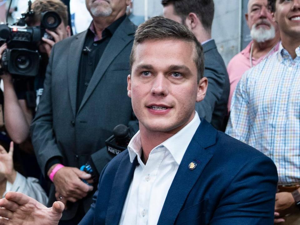 Republican Rep. Madison Cawthorn of North Carolina speaks to reporters at his campaign headquarters in Hendersonville, NC on May 17, 2022.