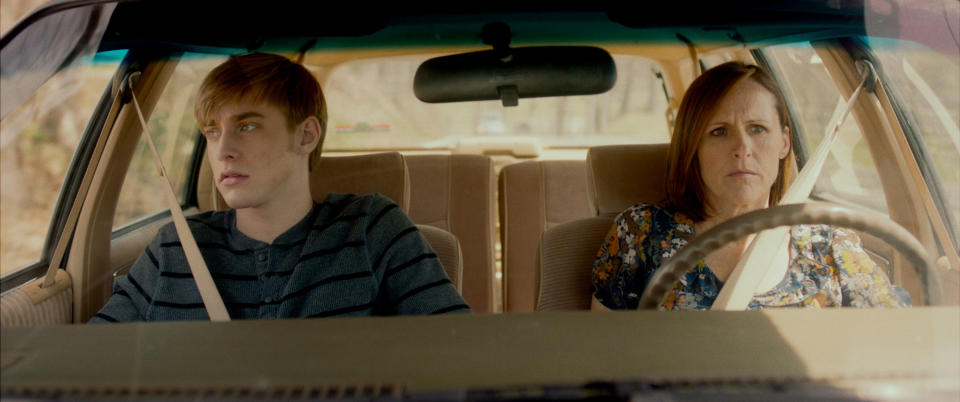 Molly Shannon sits in a car with Tim Boardman