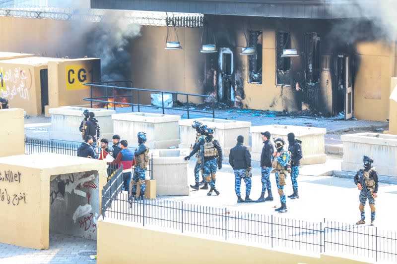 Iraqi security forces deploy during the second day of protests at the U.S. embassy in Baghdad