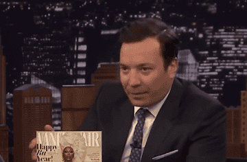 Jimmy Fallon hosting, holding a Vanity Fair magazine featuring Oprah Winfrey on the cover
