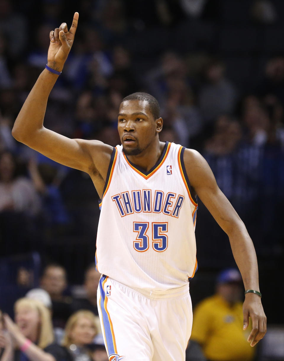 Oklahoma City Thunder forward Kevin Durant (35) gestures after making a basket in the second quarter of an NBA basketball game against the Brooklyn Nets in Oklahoma City, Thursday, Jan. 2, 2014. (AP Photo/Sue Ogrocki)