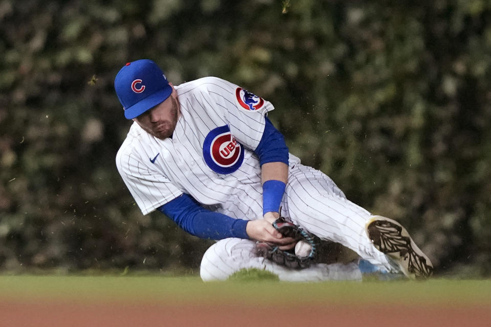 Chicago Cubs left fielder Ian Happ is unable to catch an RBI single by Pittsburgh Pirates' Miguel Andujar during the fifth inning of a baseball game Thursday, Sept. 21, 2023, in Chicago. (AP Photo/Charles Rex Arbogast)