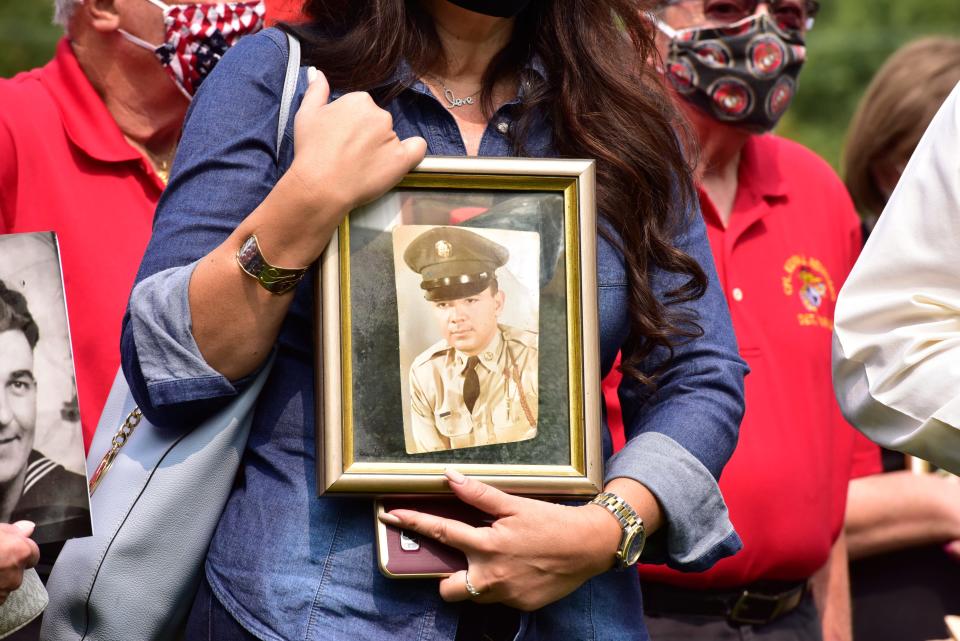 Susan Vella, of Monroe, holds a portrait of her father, Frank Vella a Army Veteran, was one of the 62 residents that died of Covid-19 complications at the New Jersey Veterans Memorial Home at Menlo Park. Veterans groups held a rally at the Menlo Park home in Edison, N.J. on Wednesday Sept. 16, 2020. 