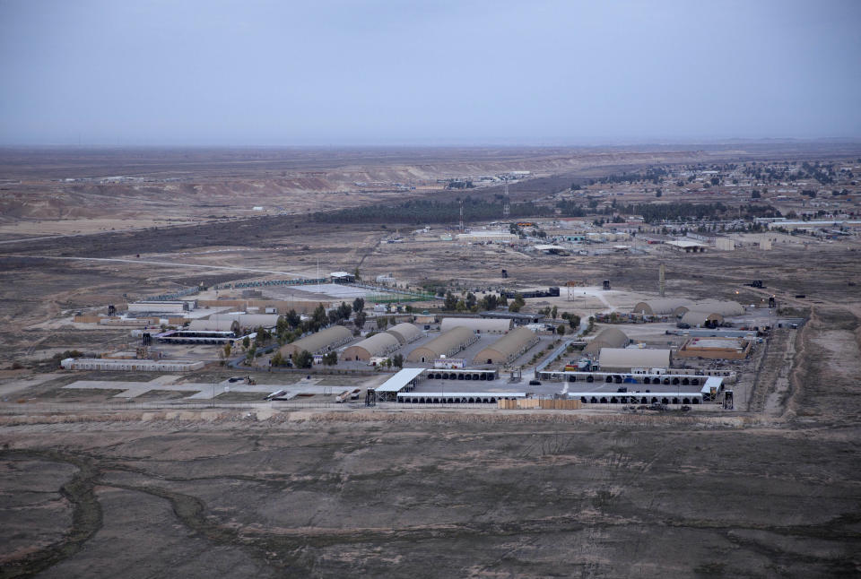 FILE - In this Sunday, Dec. 29, 2019 file photo taken from a helicopter shows Ain al-Asad air base in the western Anbar desert, Iraq. Iran struck back at the United States for the killing of a top Iranian general early Wednesday, Jan. 8, 2020, firing a series of ballistic missiles at Iraqi bases, including Ain al-Asad air base, housing U.S. troops in a major escalation that brought the two longtime foes closer to war. (AP Photo/Nasser Nasser, File)