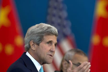 U.S. Secretary of State John Kerry speaks at a Strategic Dialogue expanded meeting with Chinese officials during the U.S.-China Strategic and Economic Dialogue held at the Diaoyutai State Guesthouse in Beijing July 10, 2014. REUTERS/Ng Han Guan/Pool