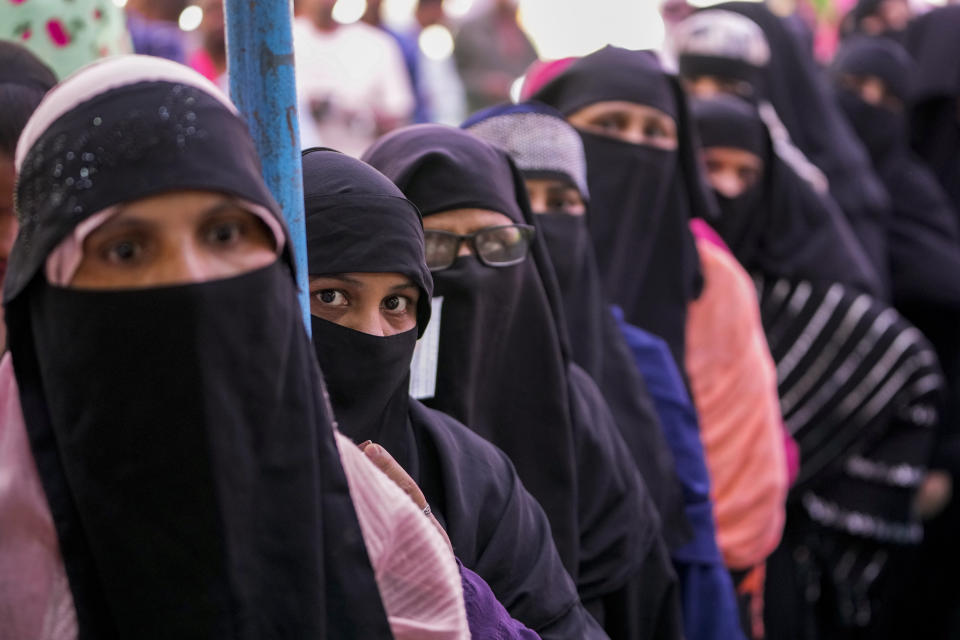 Women stand in queue to cast their votes during the third phase of general elections, in Ahmedabad, India, Tuesday, May 7, 2024. (AP Photo/Ajit Solanki)