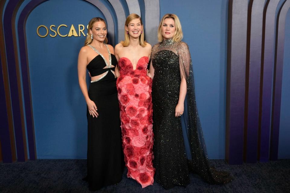 Fennell pictured with Margot Robbie (L) and Rosamund Pike (centre) (Chris Pizzello/Invision/AP)