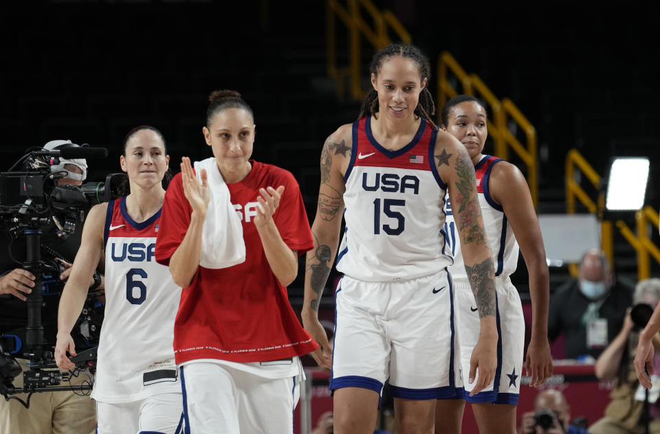 United States' players celebrate their win as they walk up the court during the women's basketball semifinal game against Serbia at the 2020 Summer Olympics, Friday, Aug. 6, 2021, in Saitama, Japan. (AP Photo/Eric Gay)