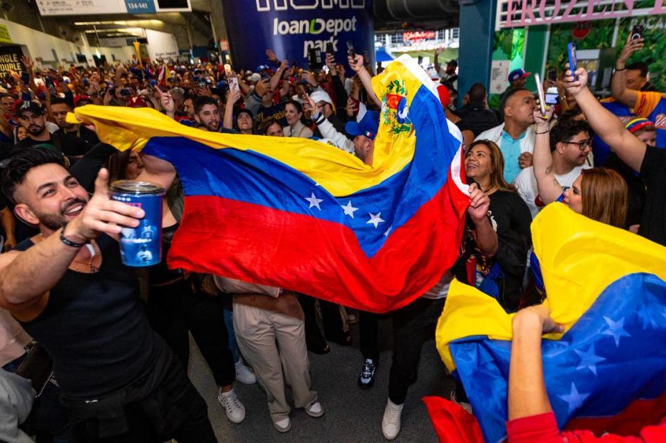 Venezuela fans react after their team won 3-1 against Dominican Republic during a Caribbean Series baseball game at loanDepot park in Miami, Florida, on Thursday, February 1, 2024.