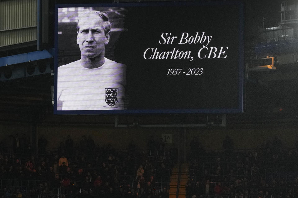 A picture of late English soccer legend Bobby Charlton is displayed on a giant screen during the English Premier League soccer match between Chelsea and Arsenal at Stamford Bridge stadium in London, England, Saturday, Oct. 21, 2023. (AP Photo/Frank Augstein)