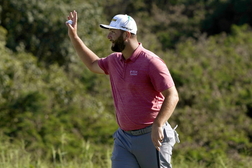 Jon Rahm, of Spain, waves after finishing the final round of the Tournament of Champions golf event, Sunday, Jan. 9, 2022, at Kapalua Plantation Course in Kapalua, Hawaii. (AP Photo/Matt York)