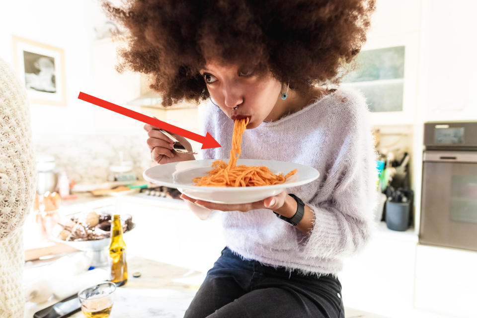 Slurping a bowl of spaghetti with ketchup