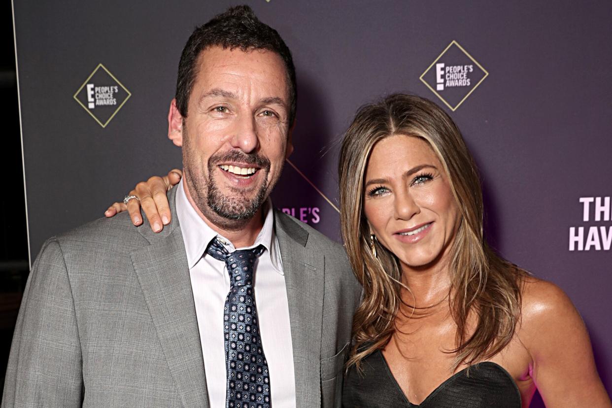Adam Sandler and Jennifer Aniston pose backstage during the 2019 E! People's Choice Awards held at the Barker Hangar on November 10, 2019
