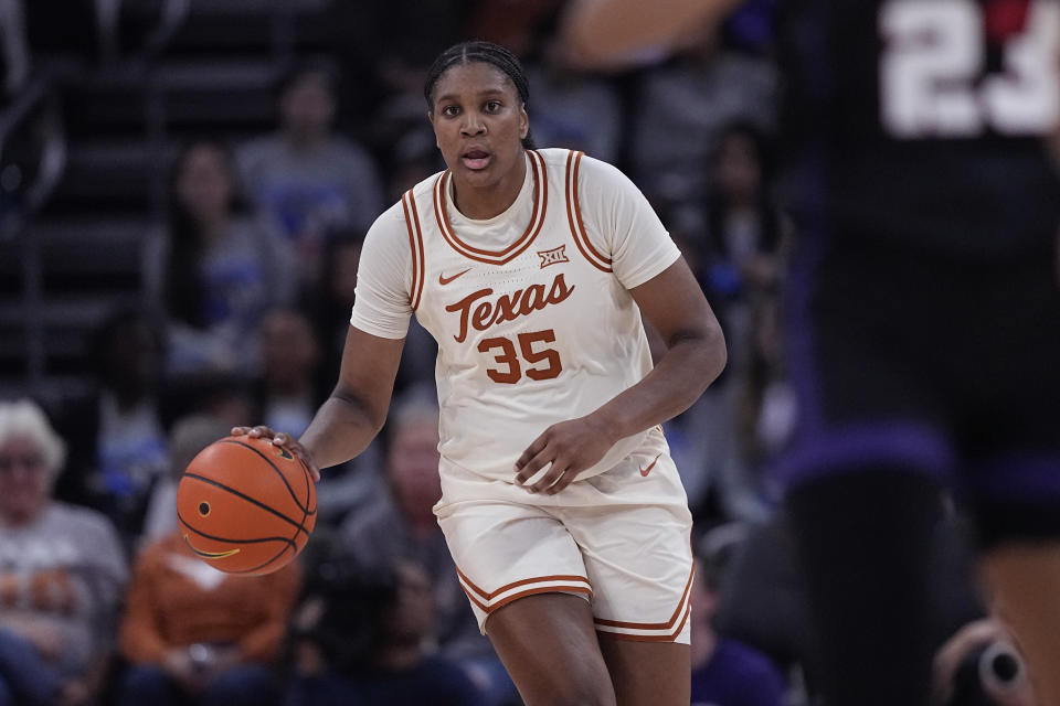 Texas forward Madison Booker brings the ball up against TCU during the second half of an NCAA college basketball game in Austin, Texas, Wednesday, Jan. 10, 2024. (AP Photo/Eric Gay)